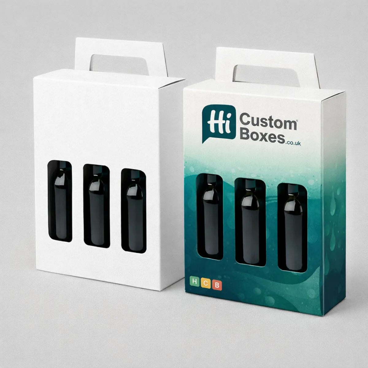 Two white cardboard carry boxes with handles and window cut-outs showing three dark bottles inside- class=